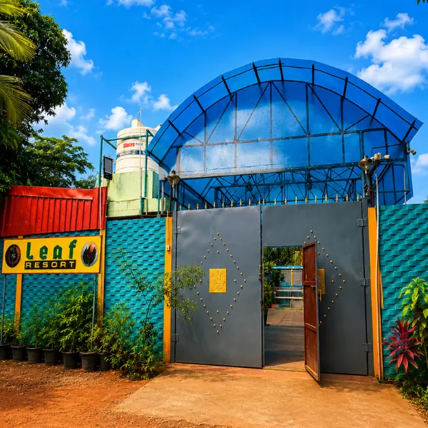 Entrance of Re Leaf Resort with its blue arched canopy