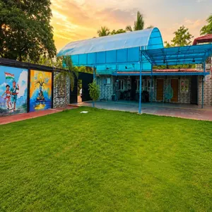 Open lawn beside the cottages at Re Leaf Resort in the evening