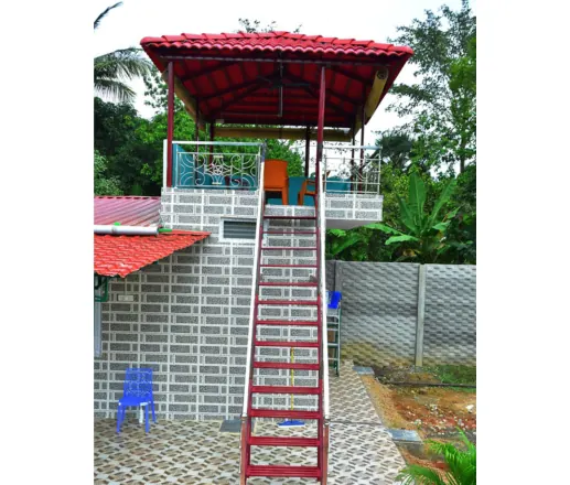 Rooftop gazebo with red staircase at the resort